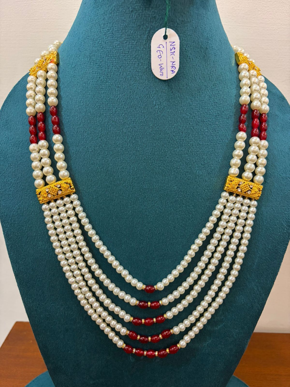 royal 5-layerd white moti pearl necklace with gold connection and red beads