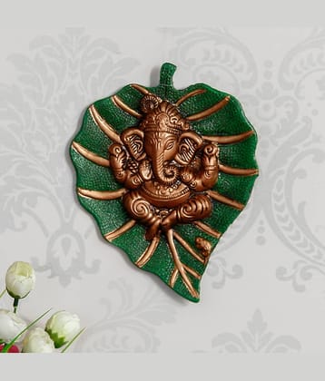 eCraftIndia Brown Lord Ganesha on Green Leaf Wall Hanging