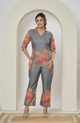Floral printed cotton blend co-ord set with button-down top and matching trousers. Floral printed cotton blend co-ord set with button-down top and matching trousers.