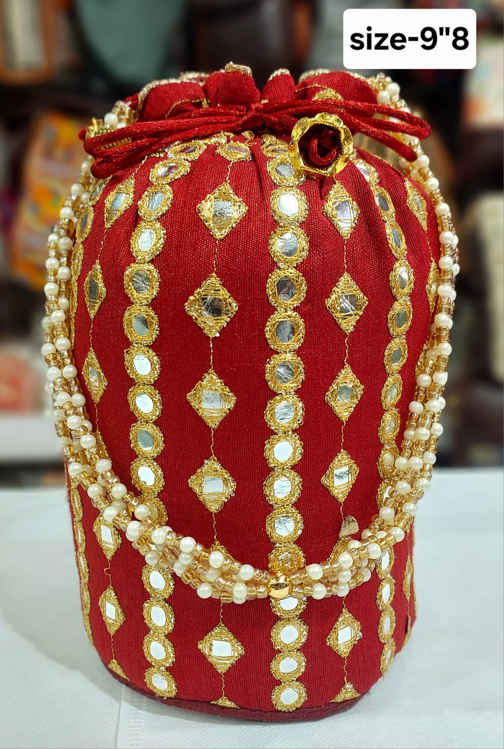 Maroon embroidered work potli bag with pearl handle