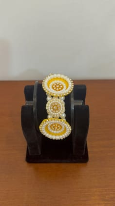 Elegant Yellow Floral Moti Bracelet Featuring White Pearl Border And Crystals