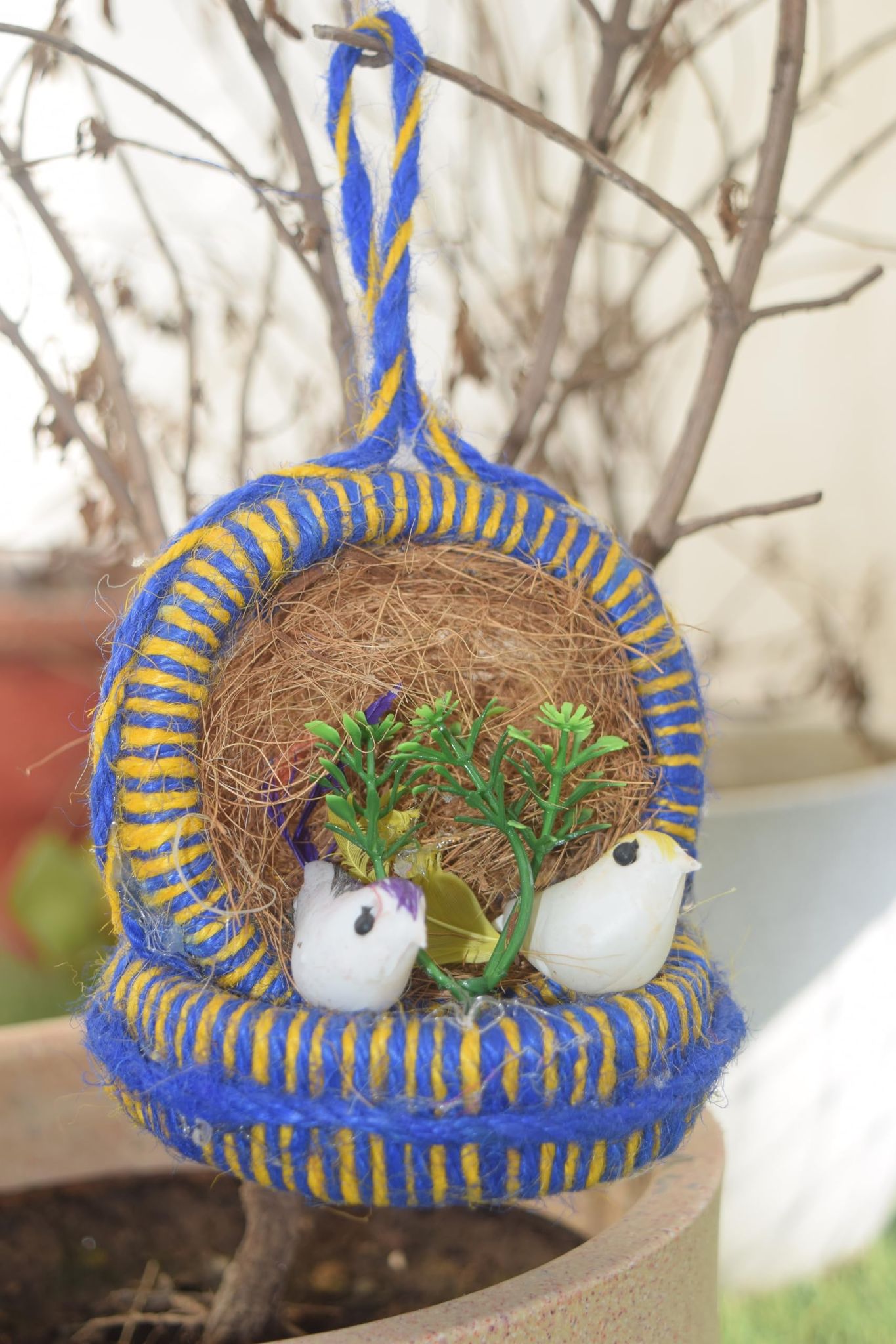 Handcrafted Bird Nest Decoration with White Doves for Home Decor, Blue and Yellow Woven Basket, Natural Coconut Shell, Artificial Greenery