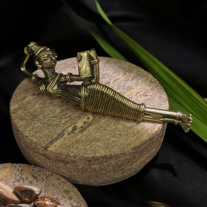 Dhokra Craft of a Tribal Woman Reading a Book While Resting Sideways Dhokra Craft of a Tribal Woman Reading a Book While Resting Sideways