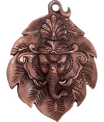 eCraftIndia Metal wall hanging of Lord Ganesha Head on Creative Leaf