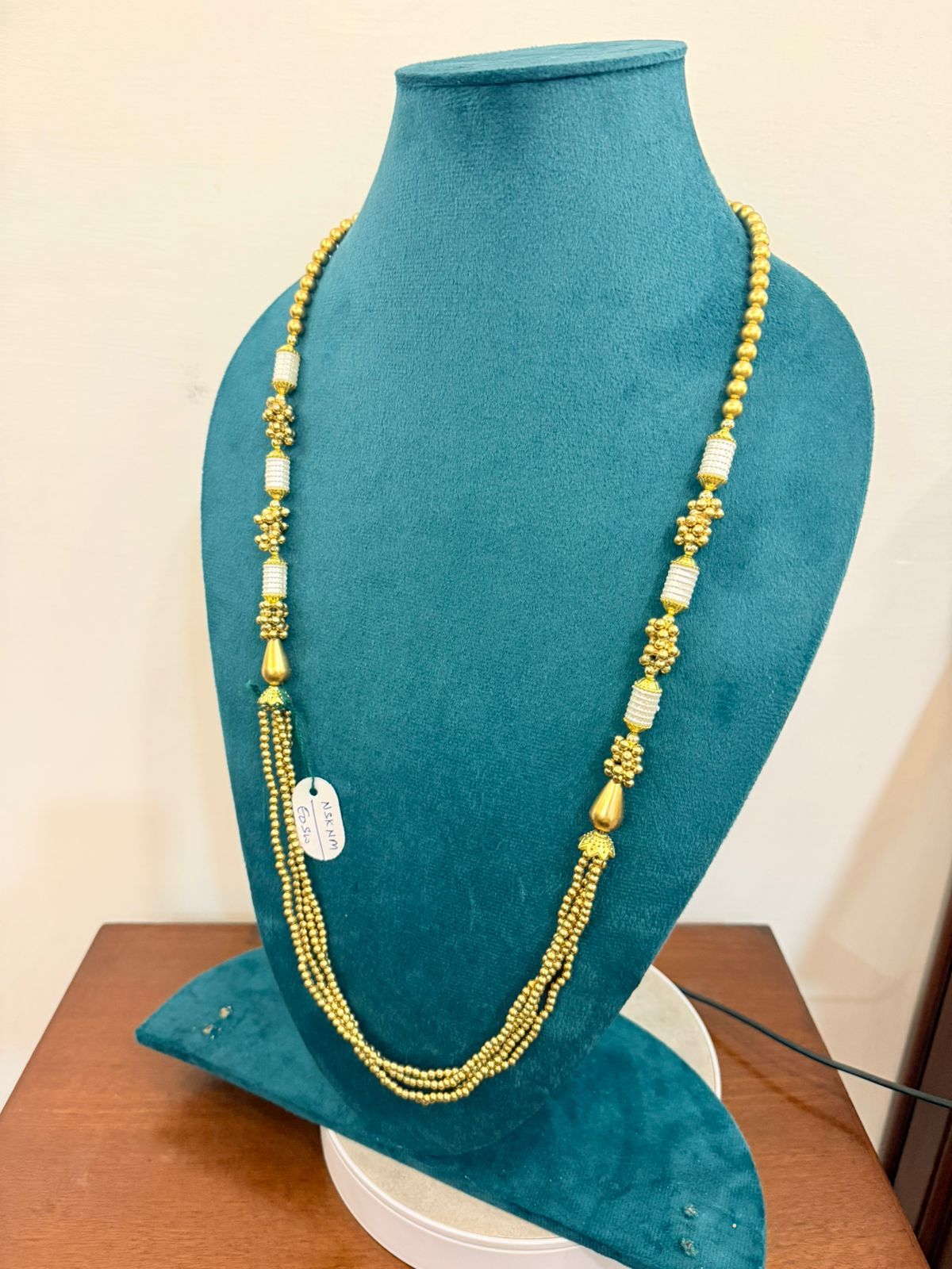 single strand and multi-layer green moti pearl necklace with gold beads