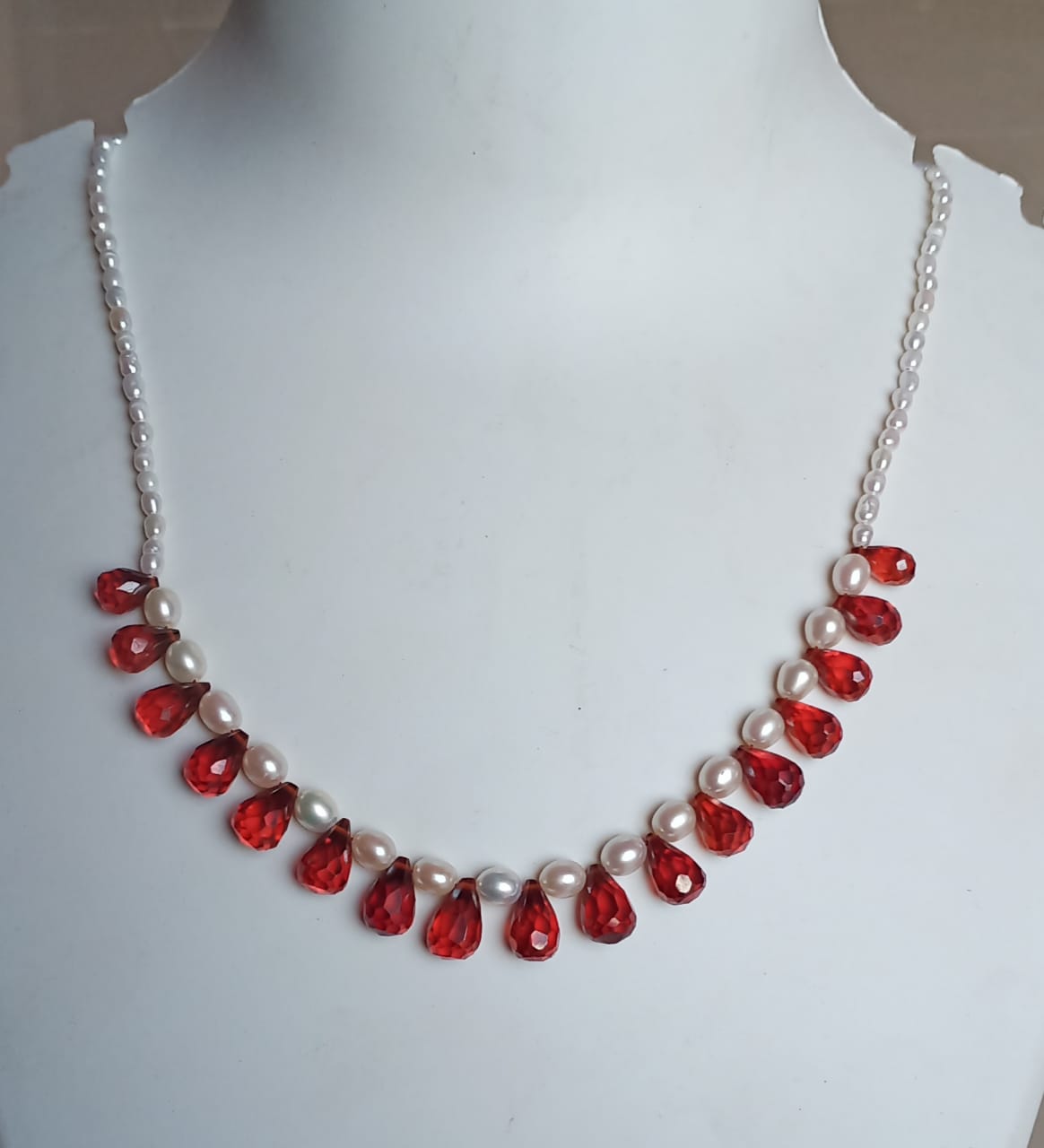 Elegant Pearl and Red Gemstone Necklace