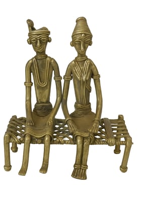 Tribal Harmony: Handcrafted Brass Couple Figurine on Charpai