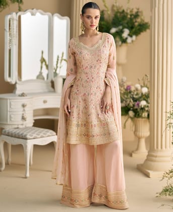 heavy wedding wear pink georgette peplum style suit for women