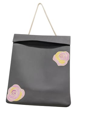 Black paper gift bag with pink and yellow heart-shaped cutouts 1Pc Black paper gift bag with pink and yellow heart-shaped cutouts 1Pc