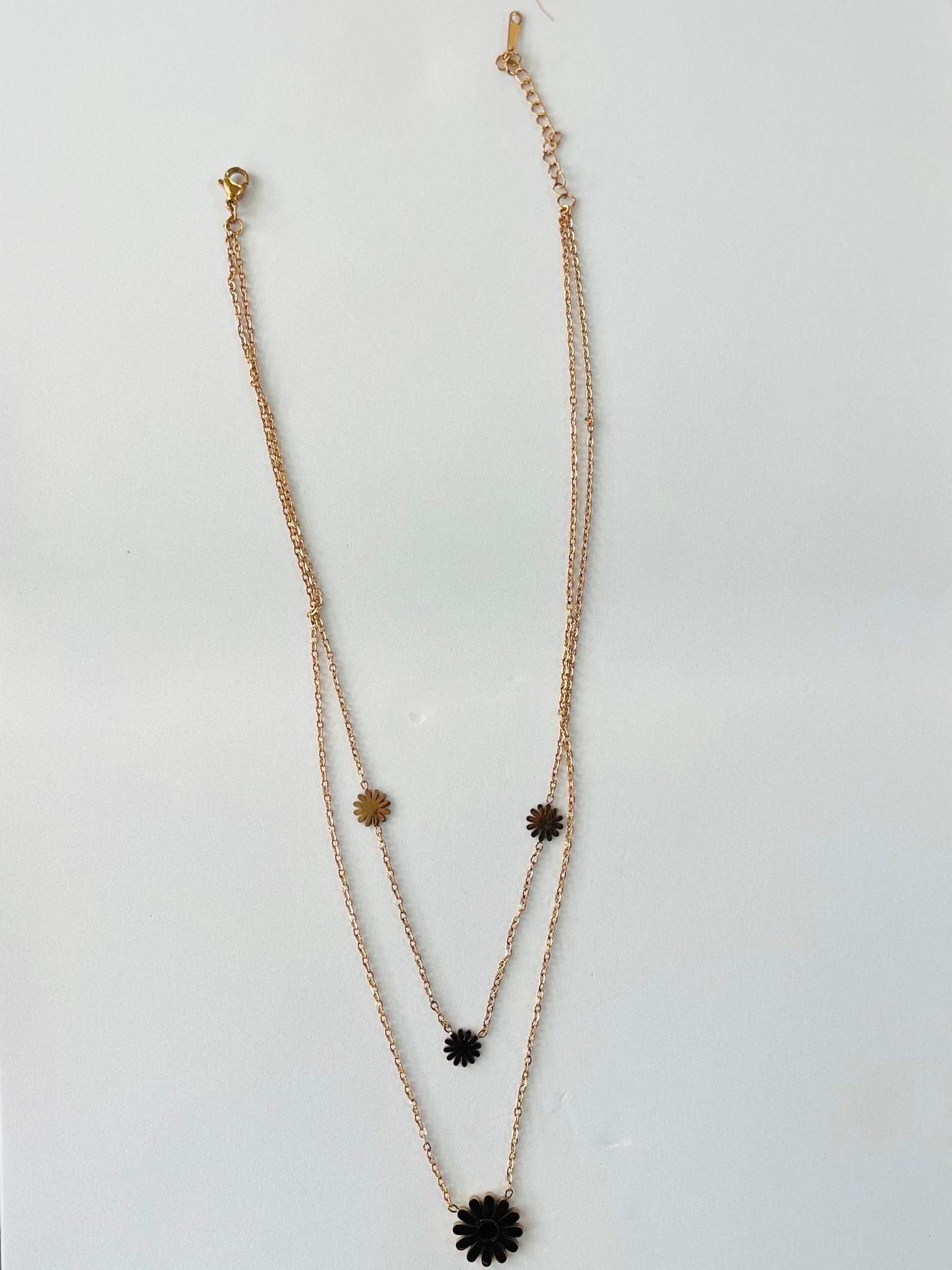 Layered Gold-Toned Necklace with Black Flower Charms