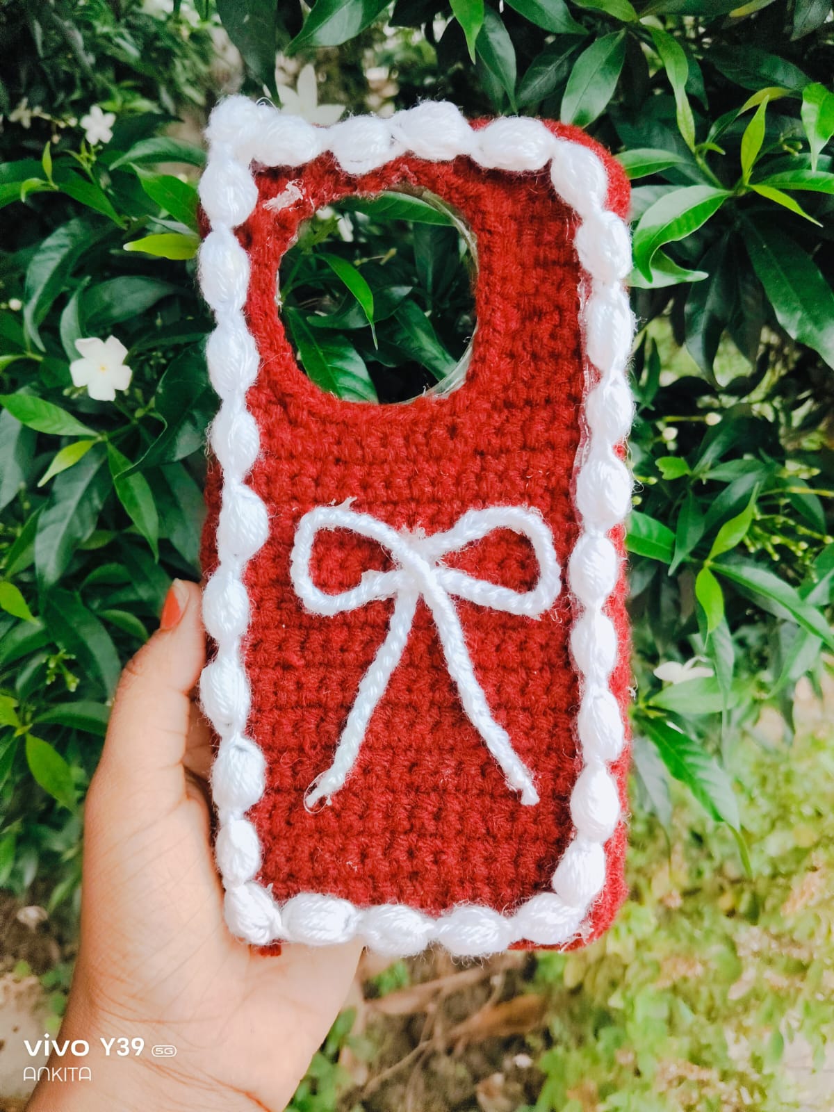 Handmade Crocheted Red Phone Case with White Bow and Pom-Pom Border