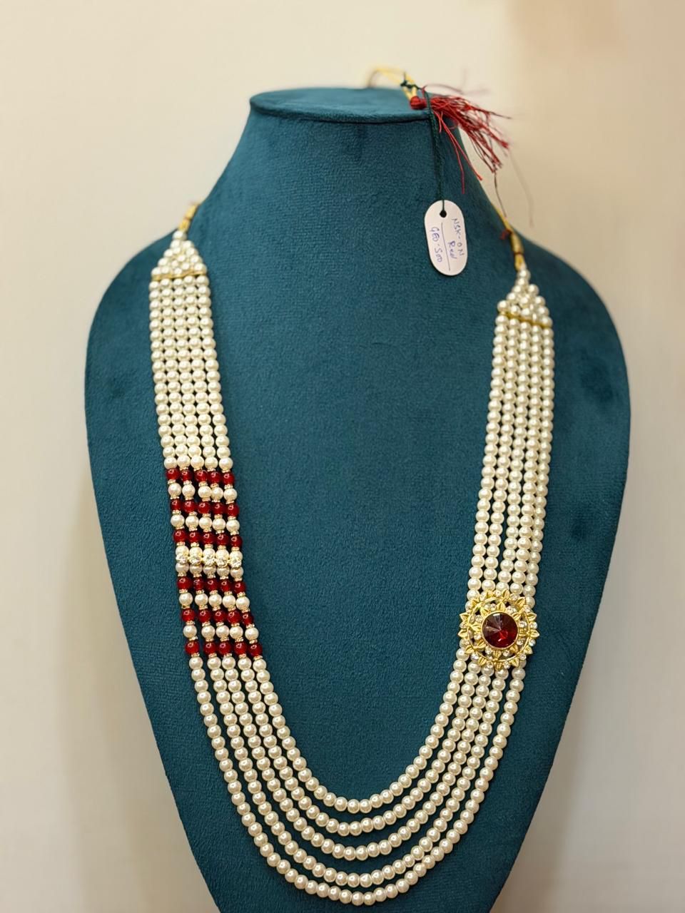 rajwadi dulha haar featuring royal round side brooch with maroon stone