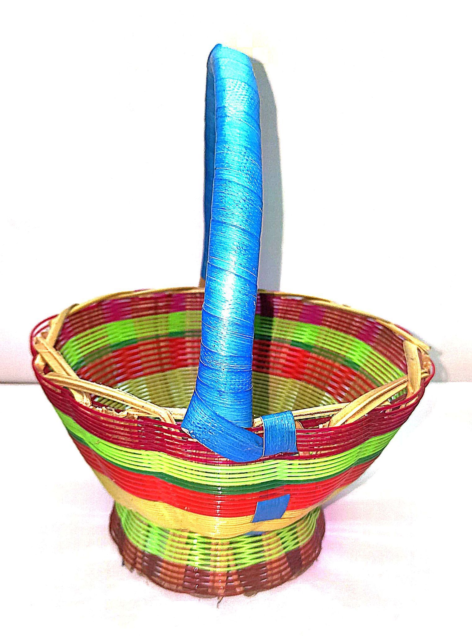 **Colorful Handwoven Wicker Basket with Blue Handle**