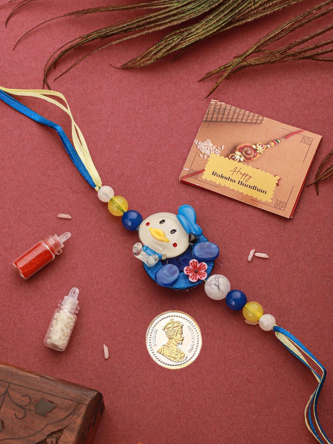 Blue Donald Duck Toy Ribbon Handcrafted Rakhi for Boys or Girls with 999 Pure Silver King George 1 gram Silver Coin