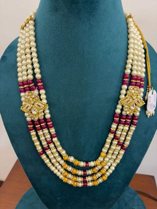 4 Strand pearl multi layer necklace featuring gold kundan side brooches and maroon beads