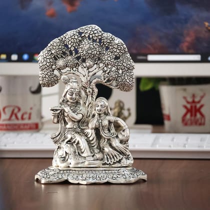 Dreamkraft Metal Radha Krishna Idol Under Tree Showpiece for Puja Room, Home & Office Desk Decor 18 cm Height | Silver Finish | Ideal for Gifting | Decorative Figurine Dreamkraft Metal Radha Krishna Idol Under Tree Showpiece for Puja Room, Home & Office Desk Decor 18 cm Height | Silver Finish | Ideal for Gifting | Decorative Figurine