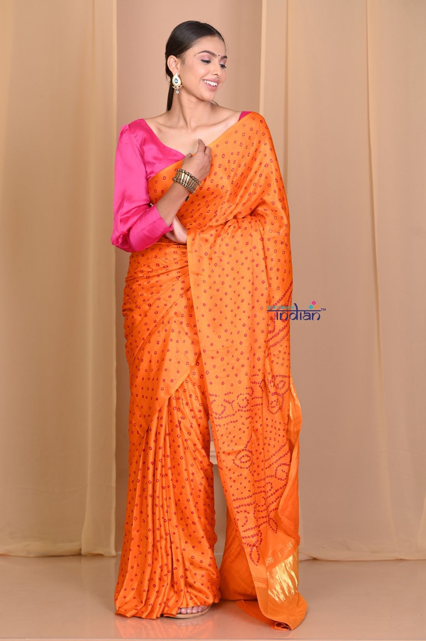 Pehal~ Traditional Light Orange Gajji silk Saree with Golden Bandhani Weave.