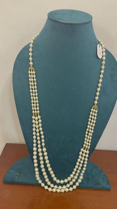 simple layered white moti pearls nd golden connectors necklace
