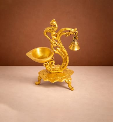 Handcrafted Brass Peacock Oil Lamp with Hanging Bell – Gold Finish Handcrafted Brass Peacock Oil Lamp with Hanging Bell – Gold Finish