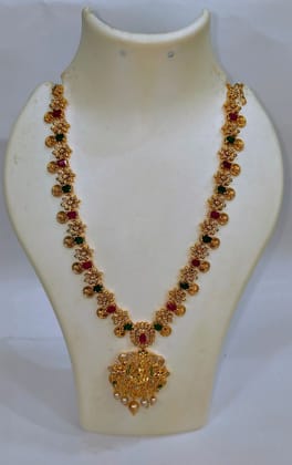 "Stunning Lakshmi Pendant Necklace with Green Stones and Pearls"