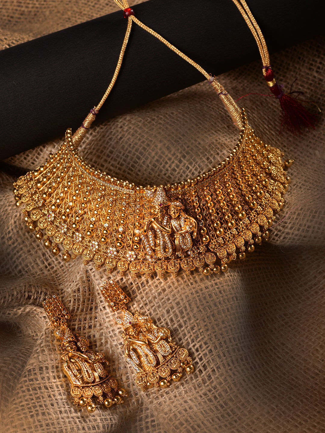 GoldPlated White AD Embellished Temple Radhe Krishna Choker Jewellery Set