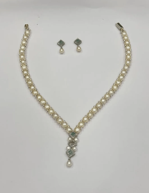 WHITE PARTY WEAR PEARL SET WITH GREEN STONE STUDS