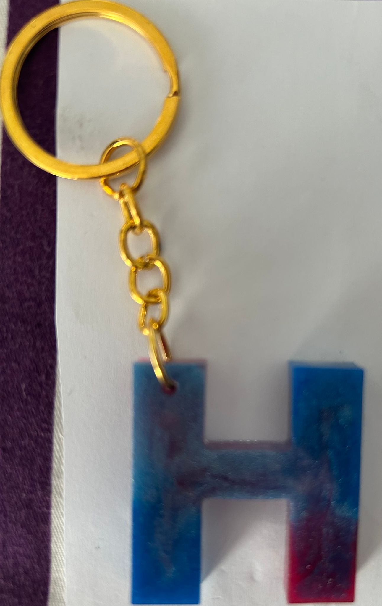 Resin blue and golden H keyring