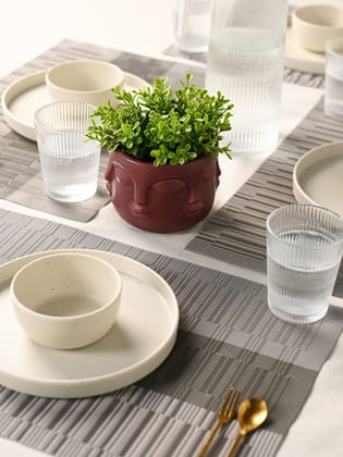 Artistic Maroon Face Planter with Faux Green Plant Decor