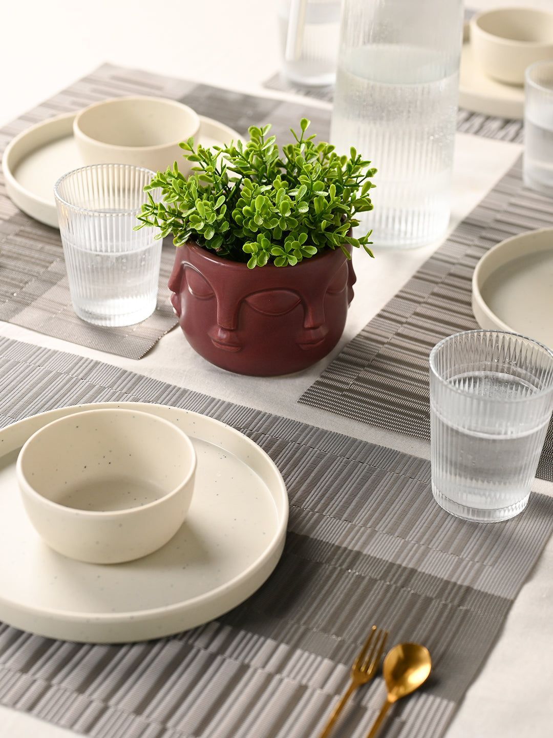 Artistic Maroon Face Planter with Faux Green Plant Decor