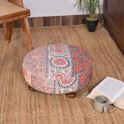 Vintage-Inspired Round Ottoman with Intricate Floral Design