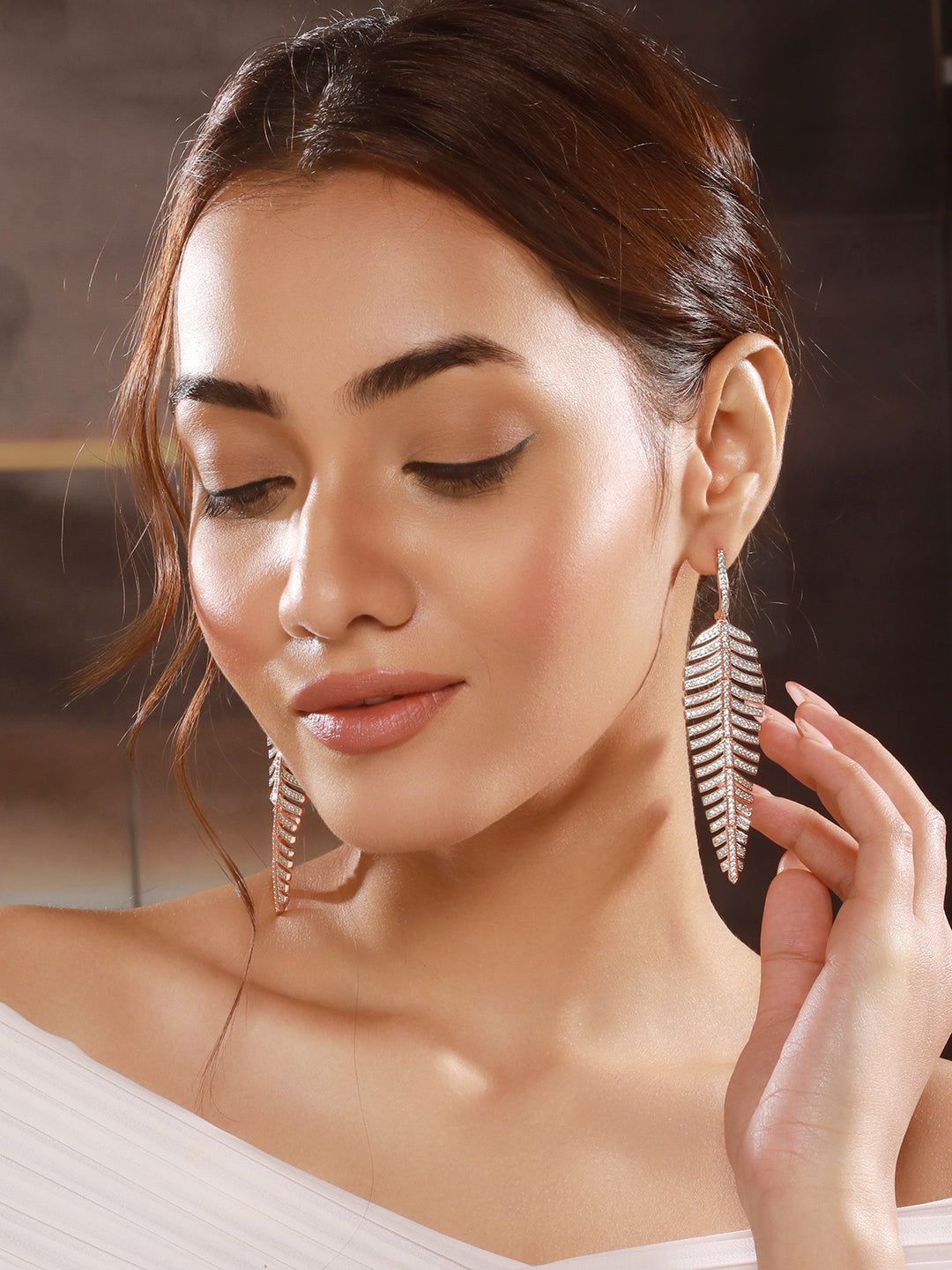 Rose Gold Toned White Zircon studded Statement Feather Dangling Earrings