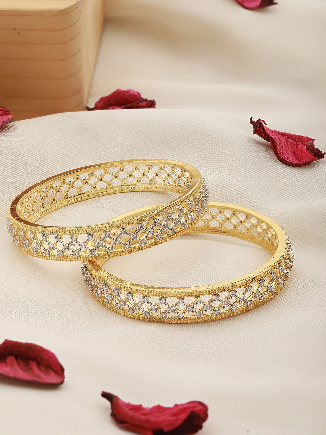 A pair of 2 Gold Dual Toned AD Studded hand Crafted Textuerd Bangles