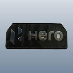 Hero Genuine Emblem Fuel Tank for Splendor | Authentic Branding Element | Durable Finish | Precise OEM Fit | Strong Adhesion | Long-Lasting Appearance – 86833AAEB00S