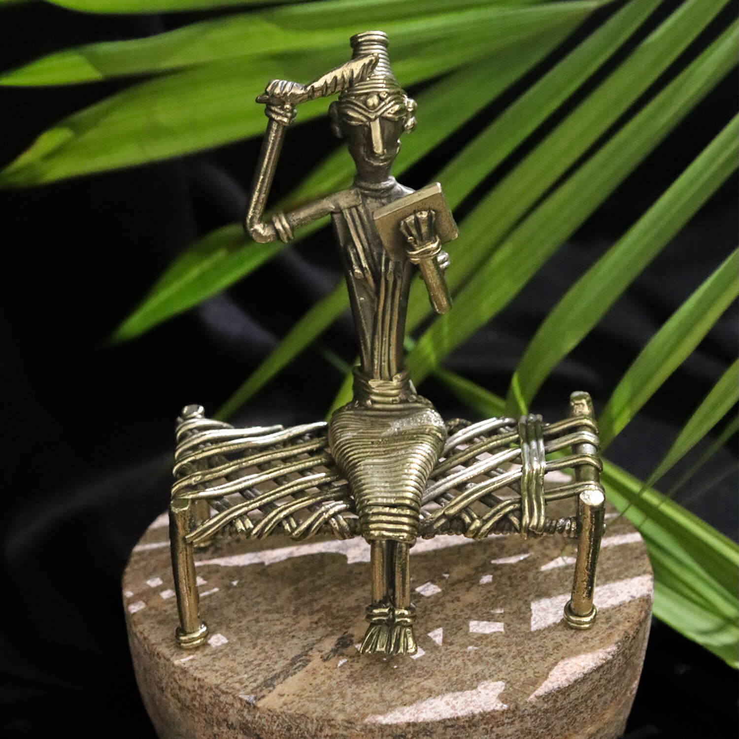 Dhokra Craft Depicting a Tribal Woman Seated on a Bed with Mirror and Comb