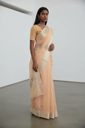 Peach Kota Doria Saree with Zari Border and Floral Pallu Peach Kota Doria Saree with Zari Border and Floral Pallu