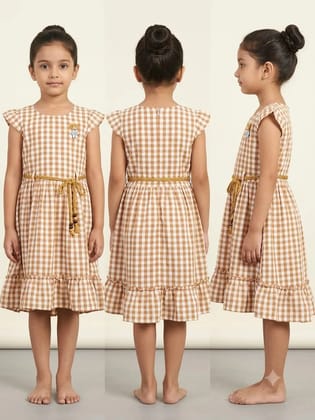 The frock is in a Blue and white check design.